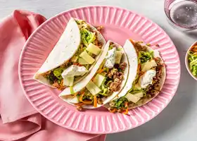 Caribbean-Inspired Pork Tacos with Pineapple, Slaw and Cilantro Crema recipe