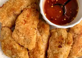 Paleo Crispy Sesame Chicken Tenders with Spicy Honey Sauce recipe