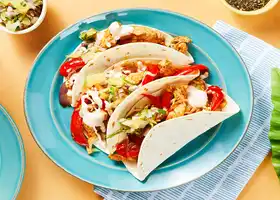 One-Pan Tropical Chicken Tacos with Pineapple Salsa and Hot Sauce Crema recipe