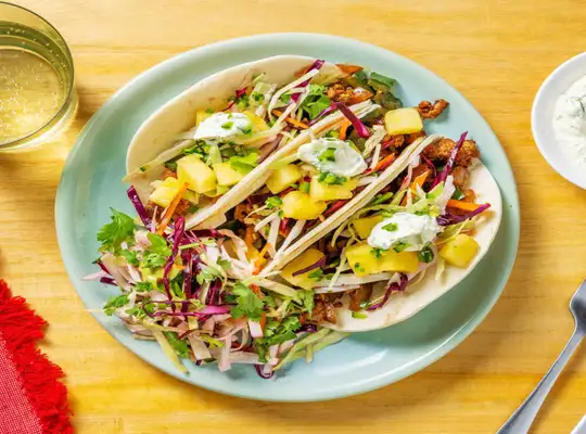 Stashcook | Caribbean-Inspired Pork Tacos with Pineapple, Slaw and Cilantro Crema