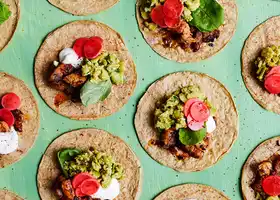 Pork belly tacos with smashed broad beans recipe