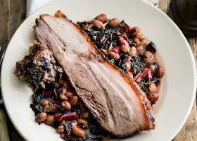 Pork belly and quince with sage and black pudding stuffing, and borlotti bean ragout recipe