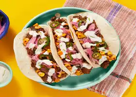 Mexican Pork & Street Corn Tacos with Chili Lime Crema recipe