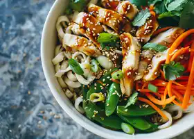 Honey-Ginger Chicken Udon Bowl with Snap Peas & Carrot Ribbons recipe