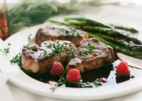 Herbed Pork Chops with Raspberry-Balsamic Sauce & Asparagus recipe