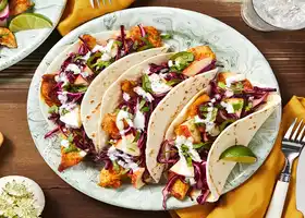 Fiesta Chicken Tacos With a Spicy Apple Cabbage Slaw and Lime Crema recipe