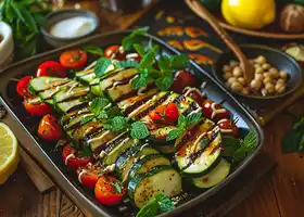 Roasted Zucchini with Spicy Almond-Tahini Dressing & Tomato Salad recipe