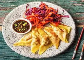 DIY Pork Dumplings with Quick-Pickled Slaw and Soy Dipping Sauce recipe